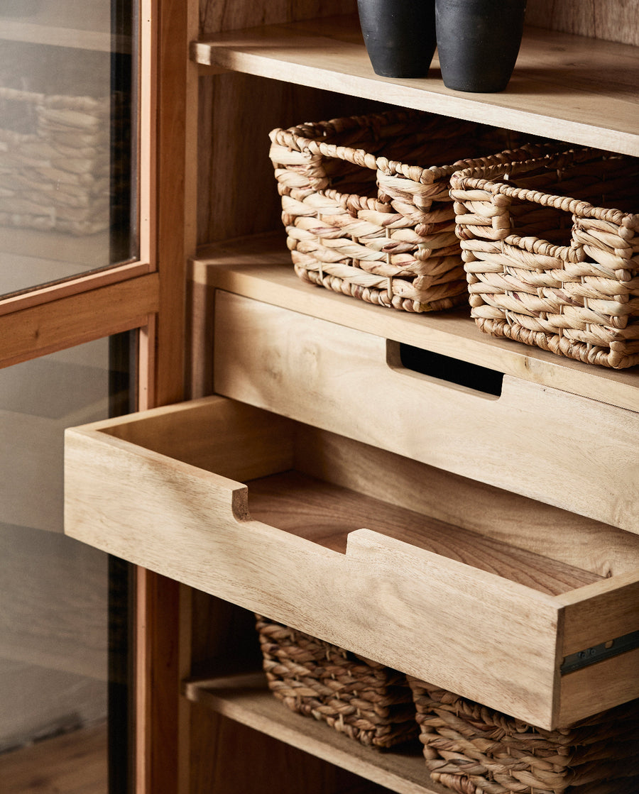 Wooden shelf with open drawer and wicker baskets
