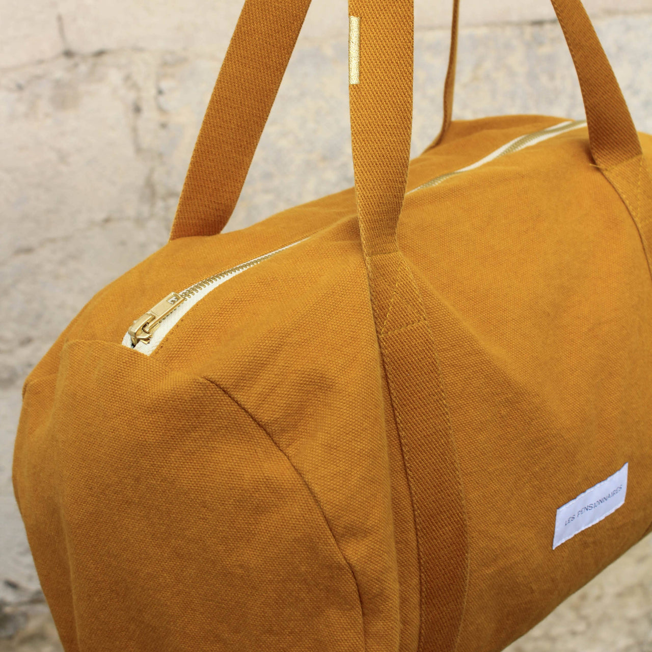 Mini bowling bag in saffron yellow organic cotton canvas