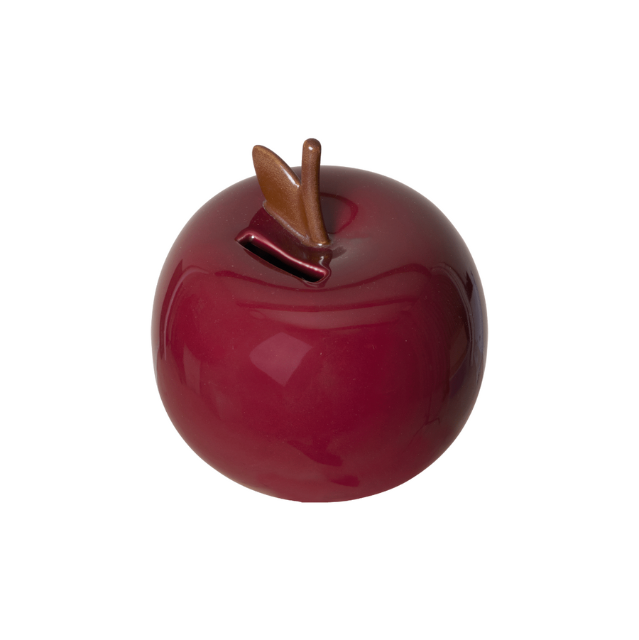 Red ceramic apple-shaped money box on a white background