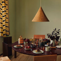 Thumbnail for Dining room with a wooden table, chairs, and a pendant lamp against a green wall.