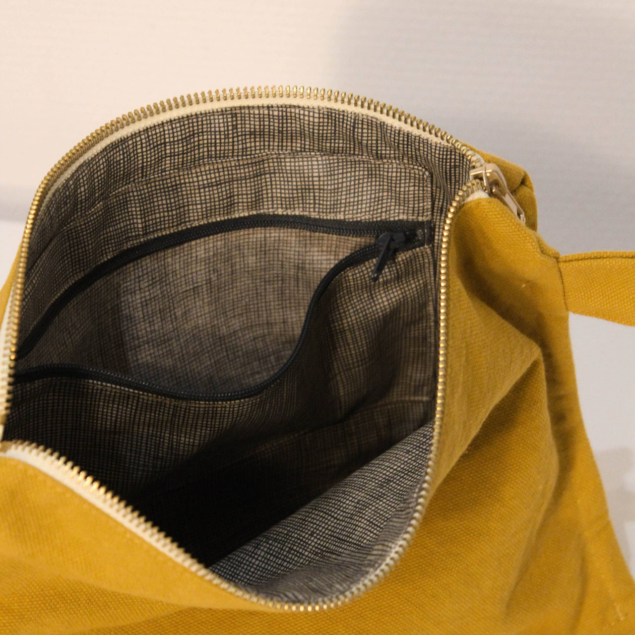Moss green toiletry bag in thick organic cotton canvas.
