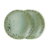 Thumbnail for Two green ceramic plates with black speckles on a white background