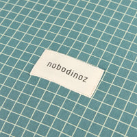 Thumbnail for Nobodinoz Changing Cover Stories Limited edition - Organic Cotton Jersey Teal ream Grid