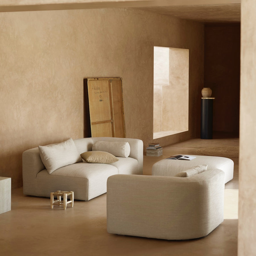 Modern living room with beige walls, furniture, and decor.