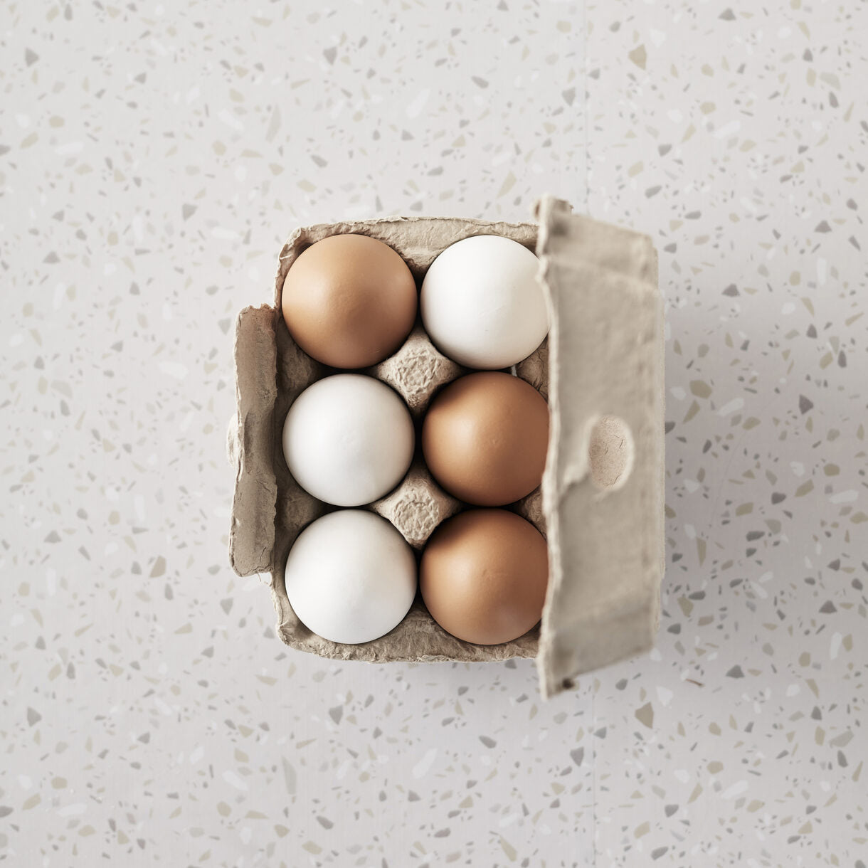 6 wooden eggs in a paper carton from Kids concept