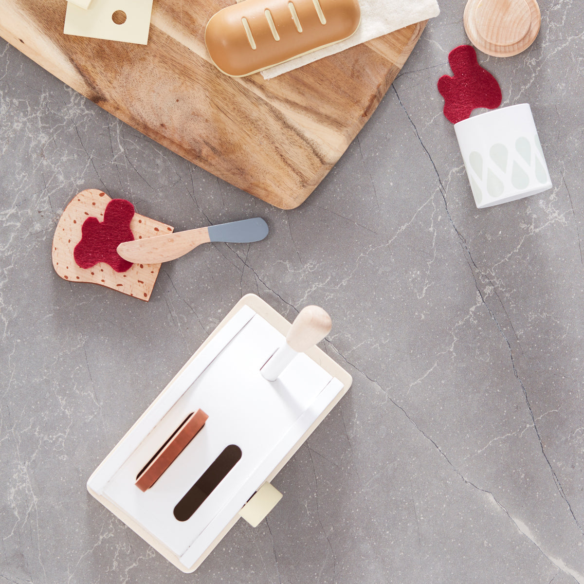 Kids concept Wooden toaster set with jam and a wooden knife