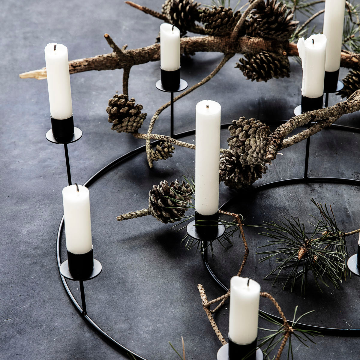 metal candle stand in a metal ring with candles from house doctor
