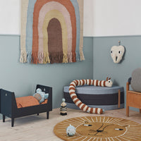 Thumbnail for oyoy living design mini collection with lion rug, rainbow wall hanging, brown and white snake toy cot and tooth fairy on the wall.