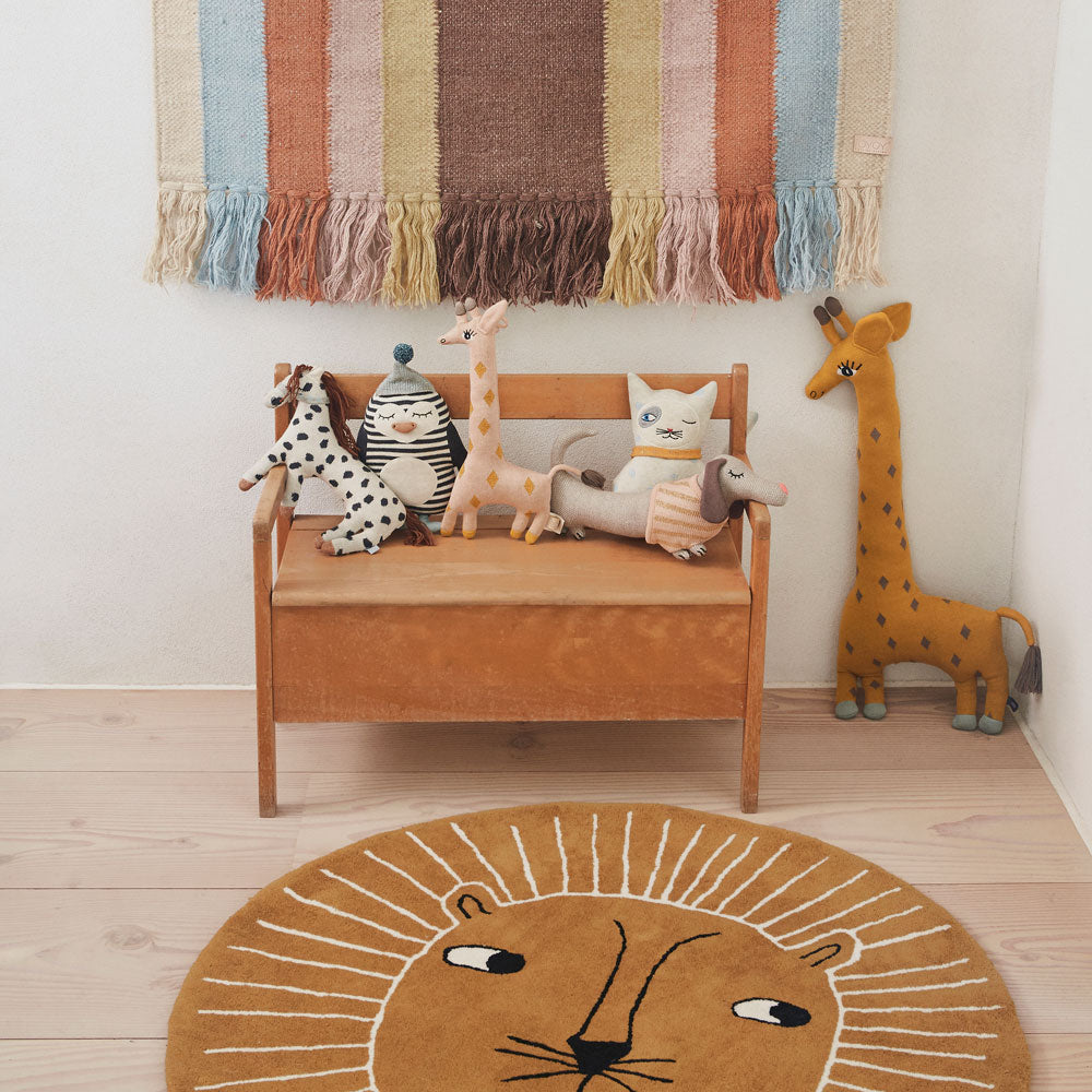rainbow wall hanging, lion rug and knitted animal cushions by oyoy living design