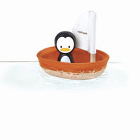 Thumbnail for Plan Toys Sailing boat Penguin Orange natural rubber wood bath toy