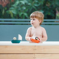 Thumbnail for Plan Toys Sailing boat Penguin Orange natural rubber wood bath toy