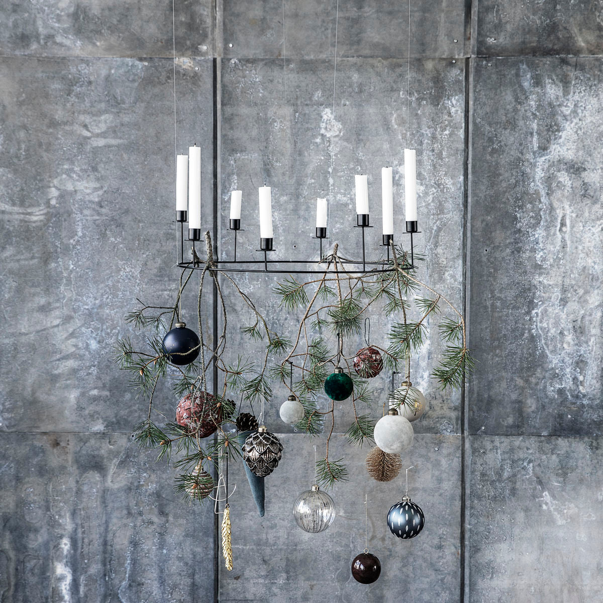 metal candle stand in a metal ring with candles from house doctor